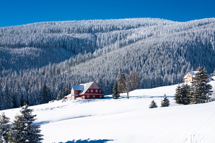 brown and white house on snow covered ground